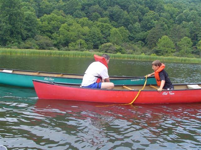 Pulling rescued canoe alongside