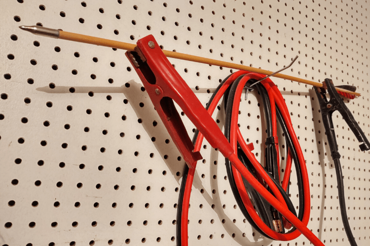 Jumper cables attached to an arrow