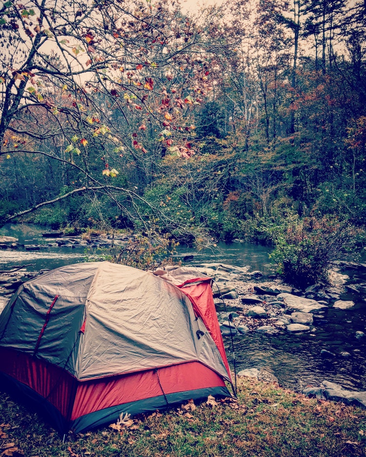 Beautiful campsite along river in autumn