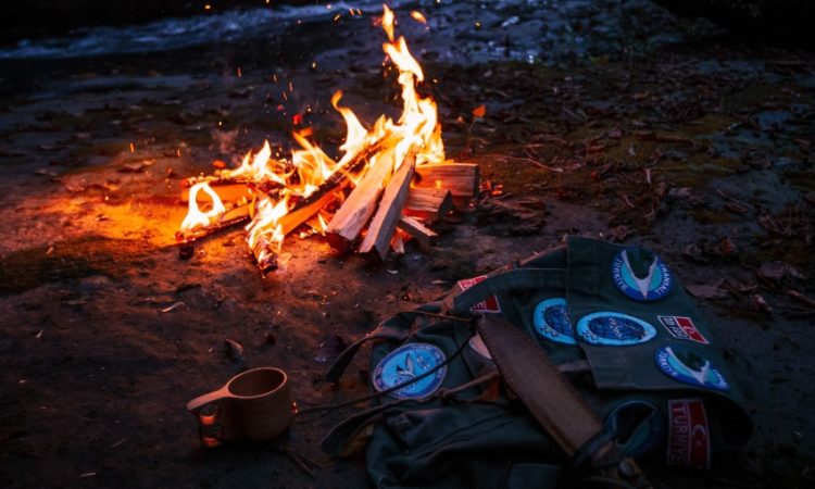 survival gear and bonfire
